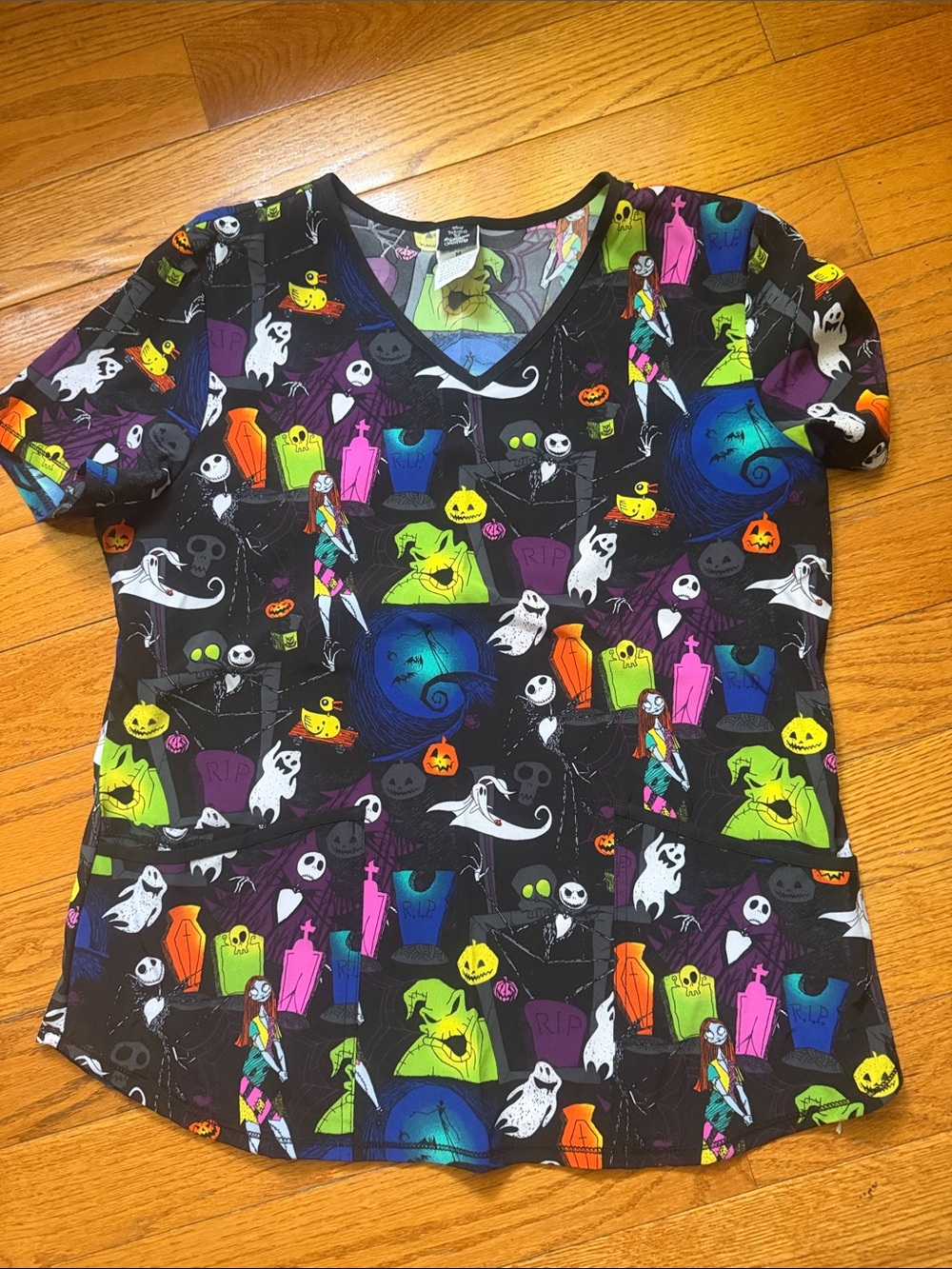Disney Woman Scrub Halloween-Themed  V-Neck Top - Black with Neon Characters